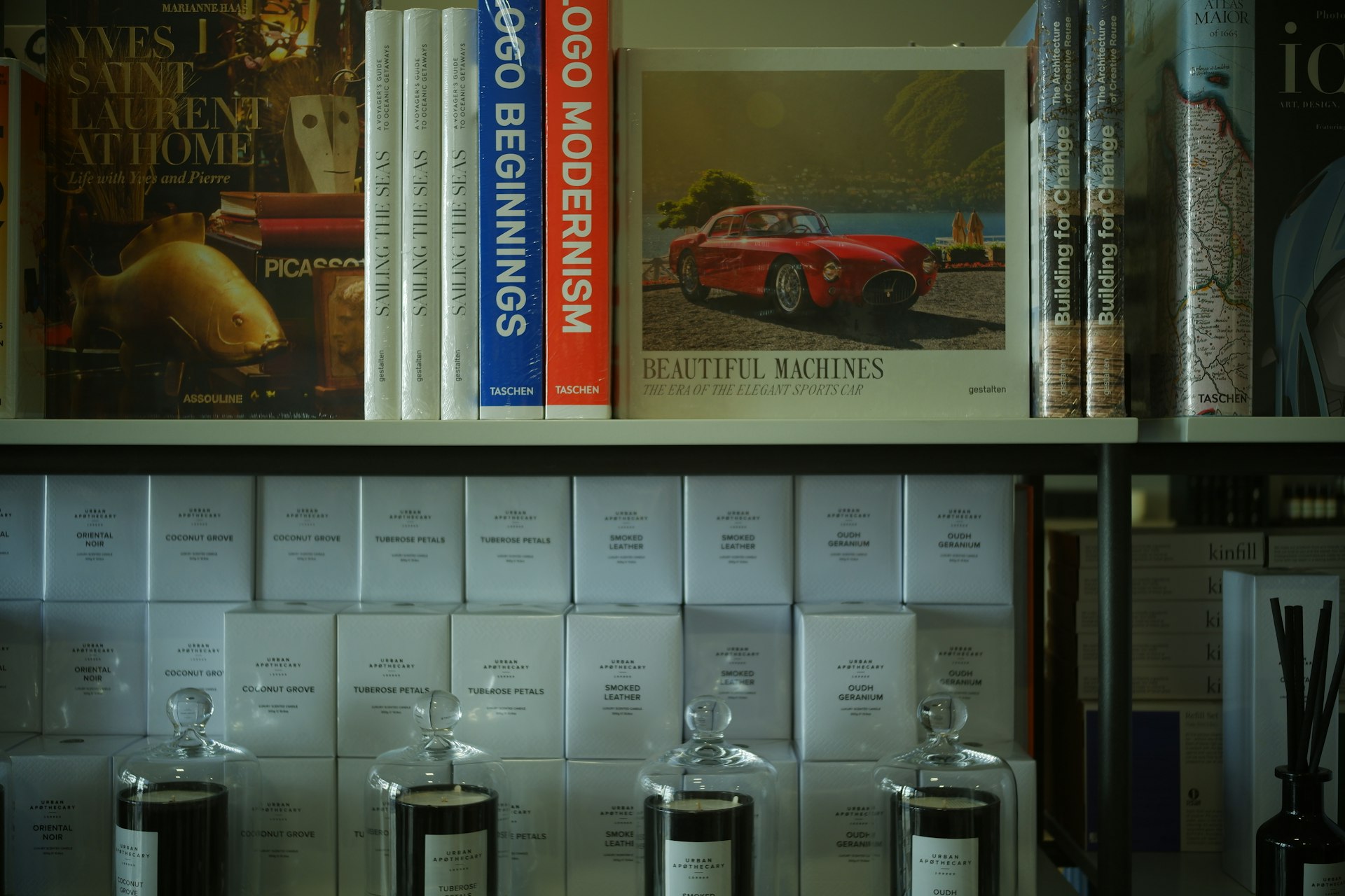 a bookshelf filled with books and bottles of liquor